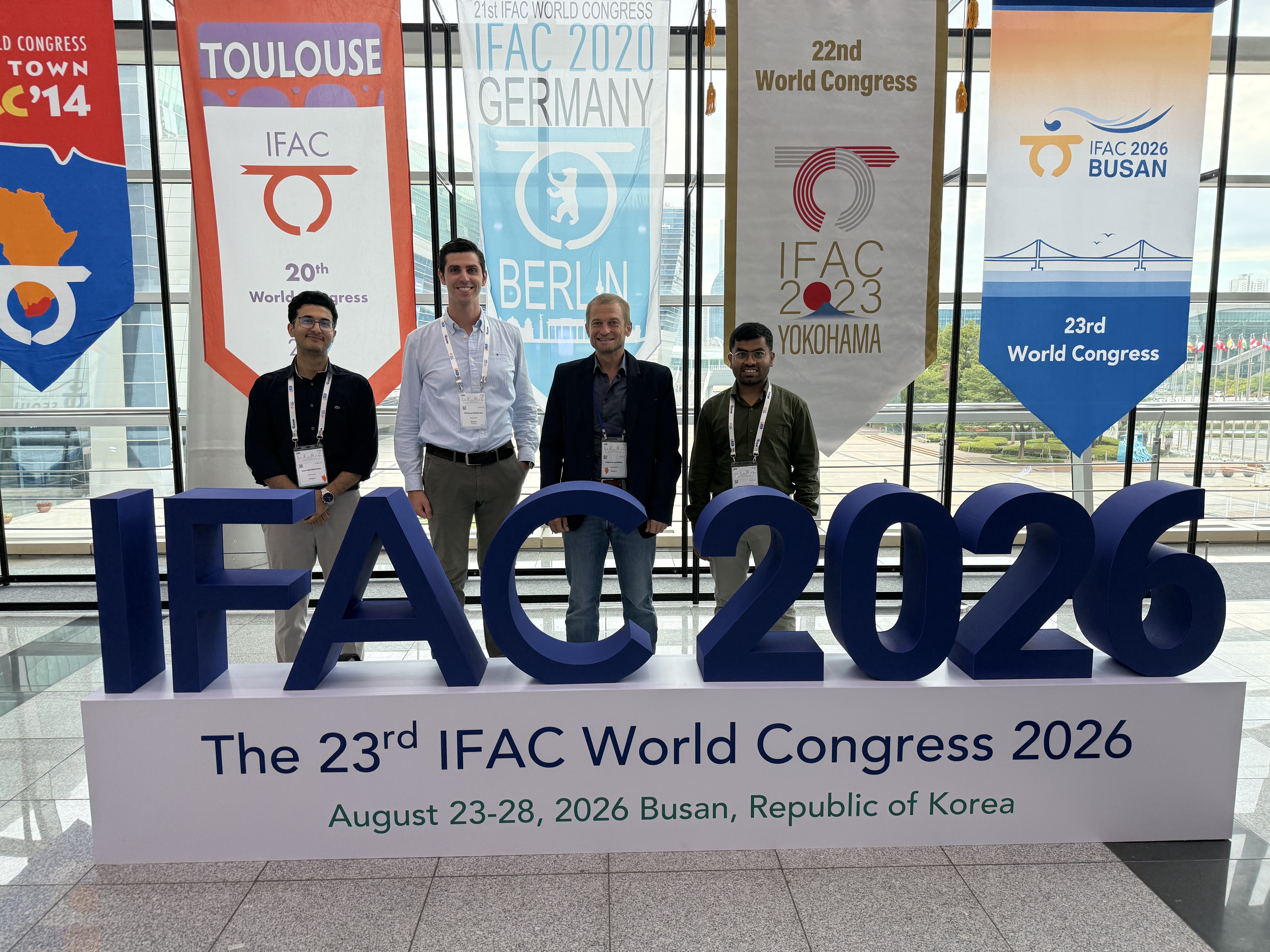 The SIDDARTA team — Raphaël Jungers, Gianluca Bianchin, Vijayanand Digge, and Amir Mehrnoosh — participated in the IFAC World Congress 2026 in Busan, South Korea, where team members presented their recent work.